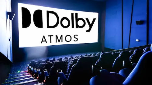 Dolby Atmos mastering engineer evaluating immersive audio translation in a professional Atmos studio
