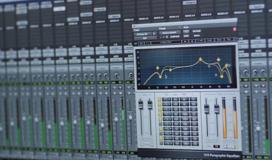 Professional mastering engineer evaluating a stereo mix before release preparation