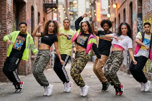 Reggaeton artist performing with crowd reacting to rhythm and movement