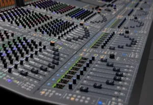 Motorized dual-fader workflow on the SSL Odyssey console designed for fast analog session recall and hybrid studio production