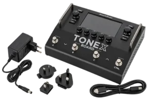 IK Multimedia TONEX Board floor processor connected to a studio guitar recording setup
